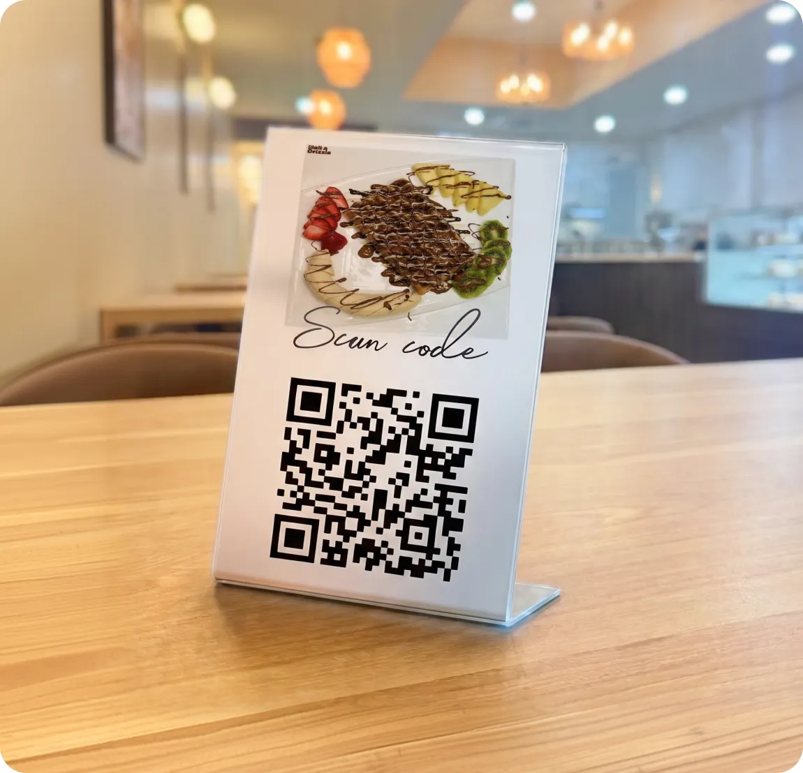 Customer scanning a table QR code to order and pay on their phone at an Innowi-powered restaurant