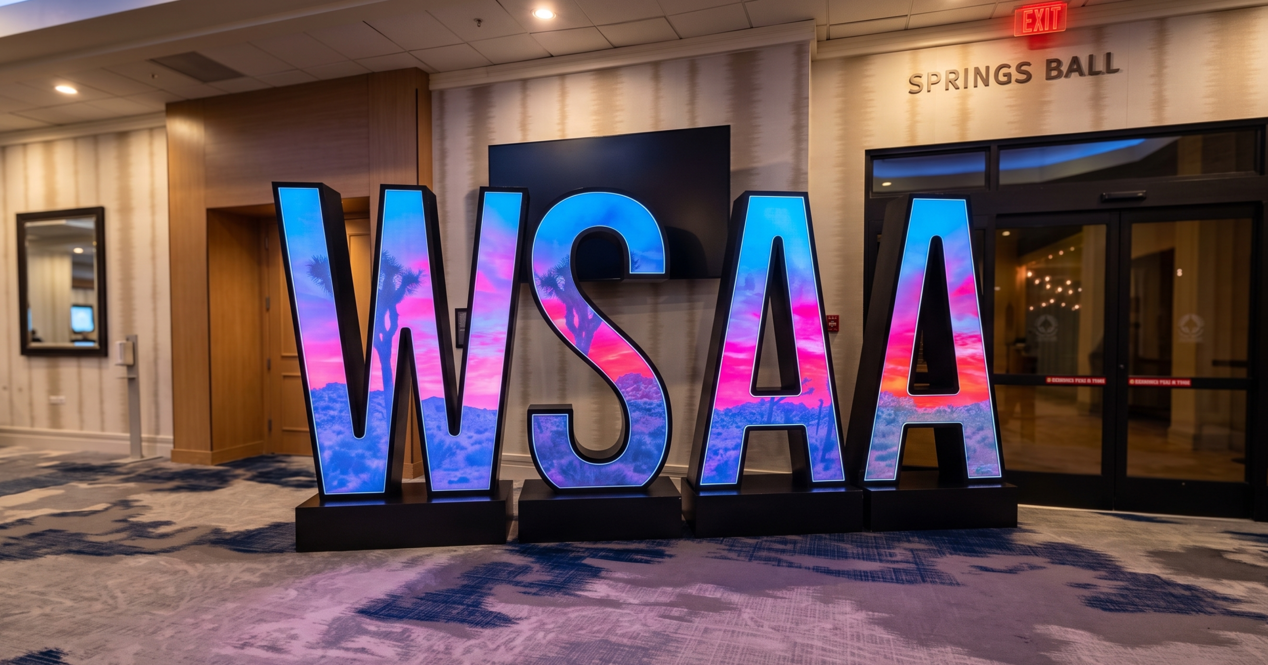 Illuminated WSAA letters outside the Springs Ballroom at WSAA 2026
